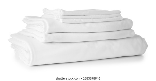 Stack of clean bed sheets on white background