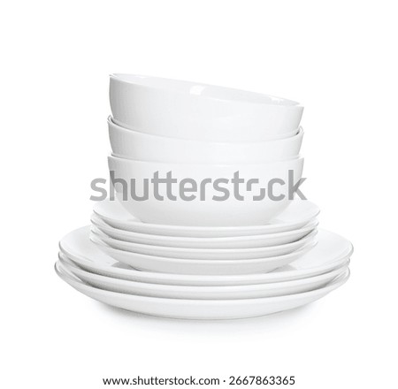 Stack of clean dishware isolated on white