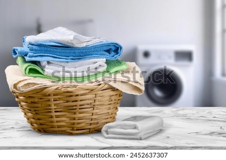 Stack of clean sheets and cloth in laundry room