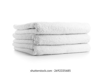Stack of clean soft towels isolated on white background, closeup