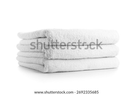 Stack of clean soft towels isolated on white background, closeup