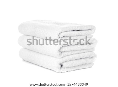 Stack of clean towels isolated on white