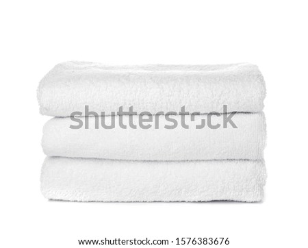 Stack of clean towels isolated on white