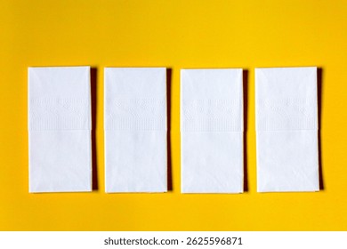 A stack of clean, white dry tissues arranged neatly on a surface. Soft texture and hygienic appearance, ideal for personal care, hygiene, or household use. Minimalist background emphasizes cleanlines