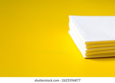 A stack of clean, white dry tissues arranged neatly on a surface. Soft texture and hygienic appearance, ideal for personal care, hygiene, or household use. Minimalist background emphasizes cleanlines