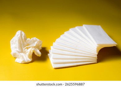 A stack of clean, white dry tissues arranged neatly on a surface. Soft texture and hygienic appearance, ideal for personal care, hygiene, or household use. Minimalist background emphasizes cleanlines