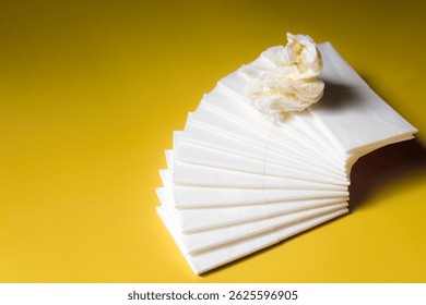 A stack of clean, white dry tissues arranged neatly on a surface. Soft texture and hygienic appearance, ideal for personal care, hygiene, or household use. Minimalist background emphasizes cleanlines