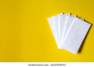A stack of clean, white dry tissues arranged neatly on a surface. Soft texture and hygienic appearance, ideal for personal care, hygiene, or household use. Minimalist background emphasizes cleanlines