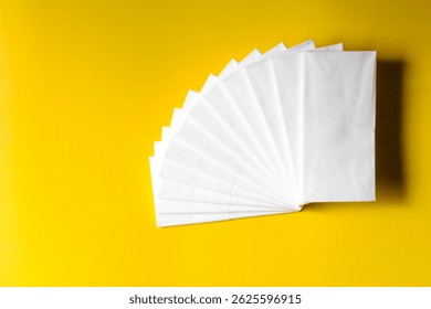 A stack of clean, white dry tissues arranged neatly on a surface. Soft texture and hygienic appearance, ideal for personal care, hygiene, or household use. Minimalist background emphasizes cleanlines
