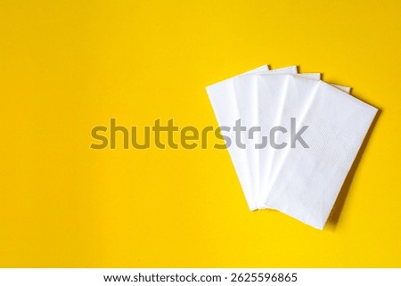 A stack of clean, white dry tissues arranged neatly on a surface. Soft texture and hygienic appearance, ideal for personal care, hygiene, or household use. Minimalist background emphasizes cleanlines