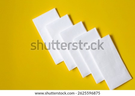 A stack of clean, white dry tissues arranged neatly on a surface. Soft texture and hygienic appearance, ideal for personal care, hygiene, or household use. Minimalist background emphasizes cleanlines