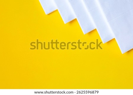 A stack of clean, white dry tissues arranged neatly on a surface. Soft texture and hygienic appearance, ideal for personal care, hygiene, or household use. Minimalist background emphasizes cleanlines