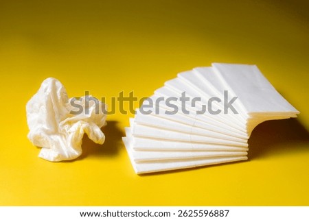 A stack of clean, white dry tissues arranged neatly on a surface. Soft texture and hygienic appearance, ideal for personal care, hygiene, or household use. Minimalist background emphasizes cleanlines