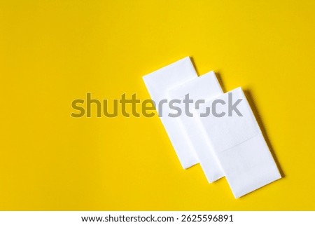 A stack of clean, white dry tissues arranged neatly on a surface. Soft texture and hygienic appearance, ideal for personal care, hygiene, or household use. Minimalist background emphasizes cleanlines