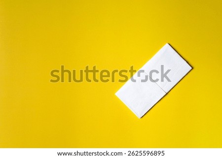 A stack of clean, white dry tissues arranged neatly on a surface. Soft texture and hygienic appearance, ideal for personal care, hygiene, or household use. Minimalist background emphasizes cleanlines