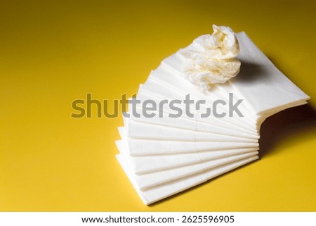 A stack of clean, white dry tissues arranged neatly on a surface. Soft texture and hygienic appearance, ideal for personal care, hygiene, or household use. Minimalist background emphasizes cleanlines