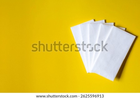 A stack of clean, white dry tissues arranged neatly on a surface. Soft texture and hygienic appearance, ideal for personal care, hygiene, or household use. Minimalist background emphasizes cleanlines