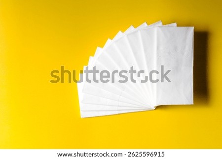 A stack of clean, white dry tissues arranged neatly on a surface. Soft texture and hygienic appearance, ideal for personal care, hygiene, or household use. Minimalist background emphasizes cleanlines
