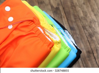 Stack Of Cloth Diapers On A Wooden Table