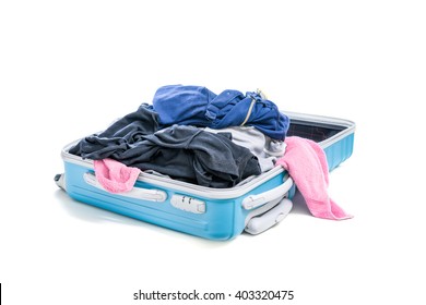 Stack Of Clothes In Open Travel Bag Isolated On White Background