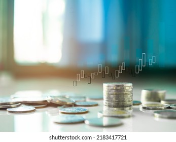 Stack Coin With Candlestick Chart On Wooden Background. Stock Market Forex Trade.pile Thai Cash And Blur Floor Bank Account. Plan Investment Income For 2023 New Year. Business Or Finance Concept.