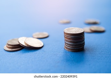 Stack Coin,Money With Blur Pile Cash On Blue Background,Bank Currency Thai,Plan Income Investment Growth And Saving For 2023 New Year,Business Or Treasury Finance Concept.