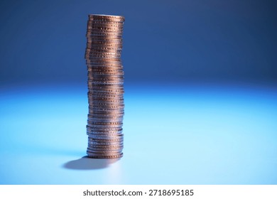 stack of coins  against blue background