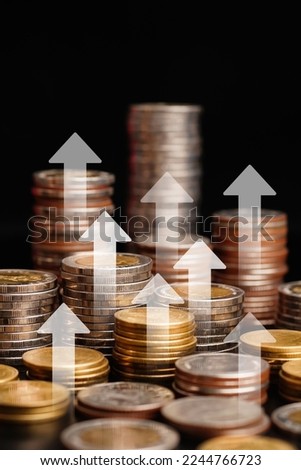 stack of coins and Arrow visual graphic in financial concepts and financial investment business stock growth. vertical	                           
