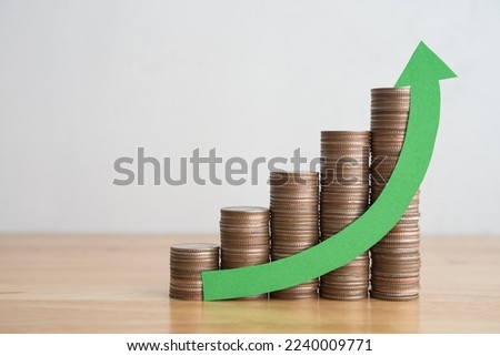 Stack of coins bar chart and green curve graph growing up with white wall background copy space. Business financial, successful investment, money saving increase, retirement planning, business growing