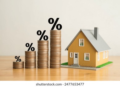 Stack coins as graph trend up and interest rates with house model background. FED fix recession inflation crisis by increase interest rate that effect to house buyer. Mortgage loan, financial concept.