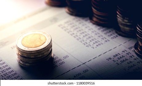 Stack Of Coins On Account Book.Business And Financial Concept.Estimated Budget For Save Money And Retirement Planning.Free Space.

