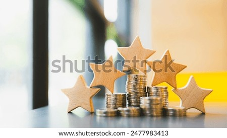 Stack of coins on the table with 5 stars symbol - concept of quality loans and debts, no bad debts.