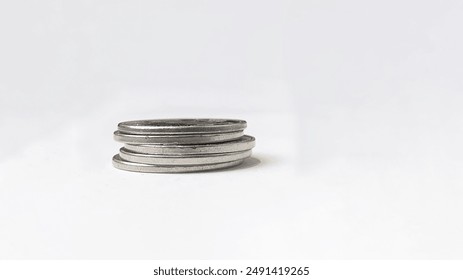 Stack of coins on a white background.