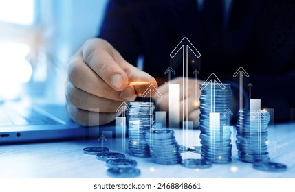 Stack of coins with trading price graph growth.Money business financial graph diagram of coin. Financial growth data or investment market profit bar and success report.Saving money concept. - Powered by Shutterstock