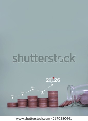 Stack of coins with virtual increasing graph. The concept of saving money for business growth, Financial investment, Market stock, Profit return, Dividend and Business fund in year 2026.