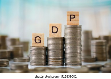 Stack of Coins with Wooden Plate Letters