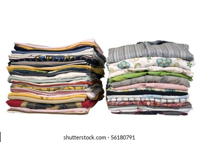 stack of colored t-shirts and shirt, front view, ironed and packed
