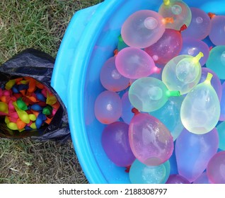 Stack Of Colored Water Balloons In A Bucket