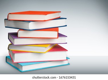 Stack Of Colorful Books Collection On The Desk