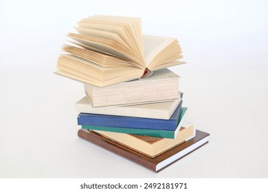 stack of colorful books on white background, open book, stack of books isolated on background, education, read, study, school, library, dictionary,university,High quality book photography - Powered by Shutterstock