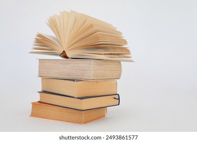 stack of colorful books on white background, open book, stack of books isolated on background, education, read, study, school, library, dictionary,university, - Powered by Shutterstock