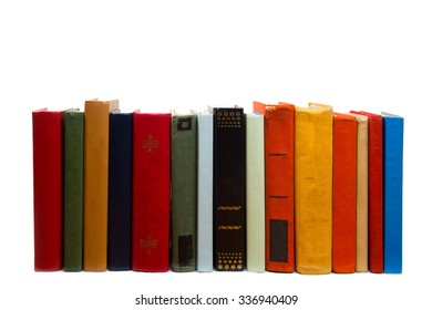 Stack Of Colorful Books On Wooden Shelf Isolated On White Background. Back To School. Copy Space For Text