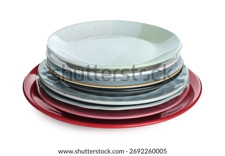 Stack of colorful ceramic plates isolated on white
