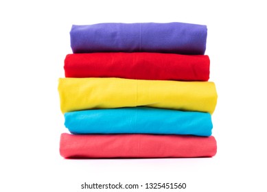 Stack of Colorful cotton T shirt isolated on white background.