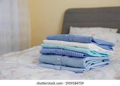 stack clothes on bed