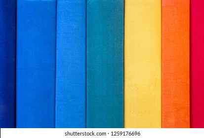 A stack of colorful rainbow books, arranged vertically. trend background. Close-up of book stubs. education concept. - Powered by Shutterstock