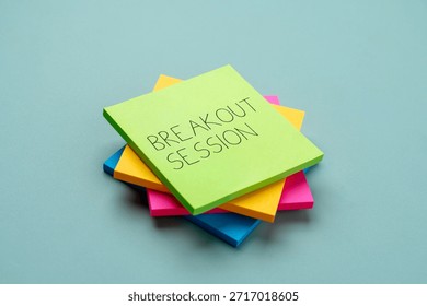 A stack of colorful sticky notes with text BREAKOUT SESSION. Meetings, conferences, workshops, brainstorming concept.
