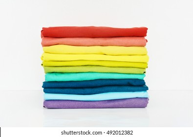 Stack Of Colorful T-shirt On White Background