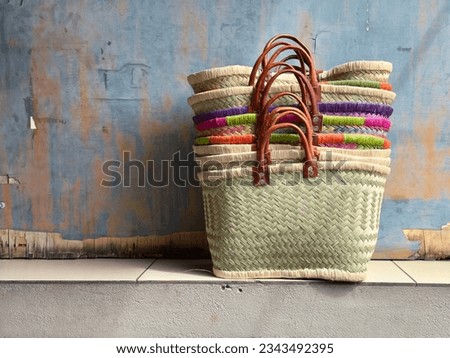 Stack of coloured woven baskets