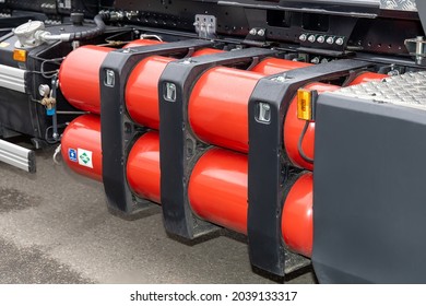 A stack of compressed natural gas cylinders on a truck frame. Truck with a methane engine. CNG as a fuel